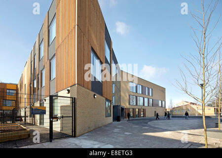 Oasis Academy Hadley, Enfield, United Kingdom. Architect: John McAslan & Partners, 2013. Corner Elevation with schoolyard. Stock Photo