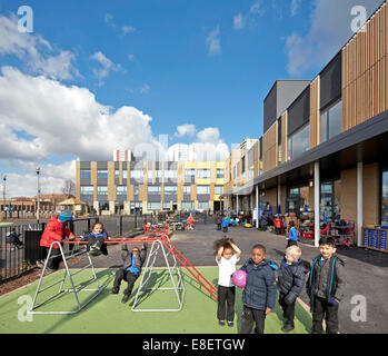 Oasis Academy Hadley, Enfield, United Kingdom. Architect: John McAslan & Partners, 2013. Campus schoolyard with playground for c Stock Photo