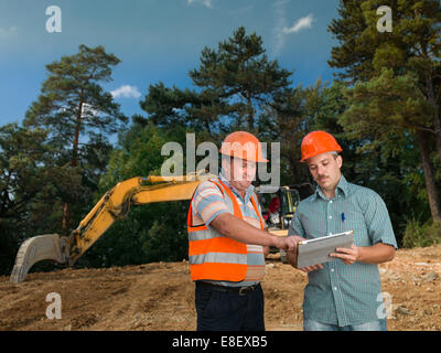 Engeniers with a plan Stock Photo
