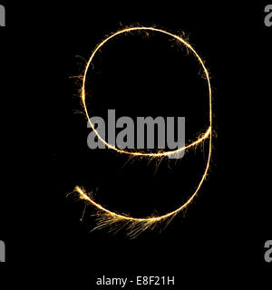 burning sparkler stick and writing sparkling text . number night  isolated on black background Stock Photo