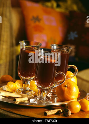 Close-up of mulled wine in glass mugs with handles Stock Photo