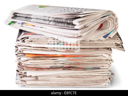 Stack Of Newspapers And The Roll Isolated On White Background Stock Photo