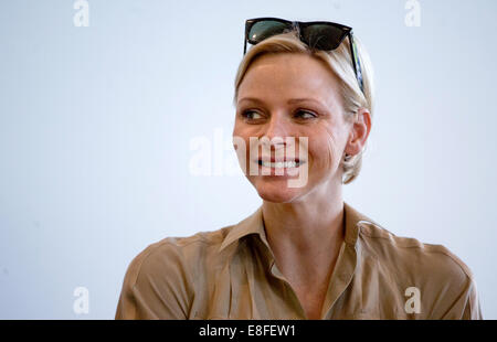 Princess Charlene of Monaco smiles during a visit to the Mercedes-Benz Museum in Stuttgart, Germany, 10 July 2012. Prince Albert II and his wife visit Germany for several days.  Photo: MARIJAN MURAT Stock Photo