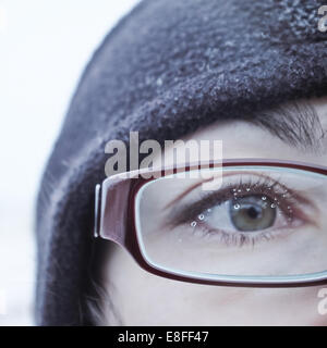 Water drops on a woman's spectacle glasses Stock Photo