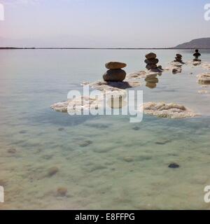 Stacks of pebbles in Dead Sea, Israel Stock Photo