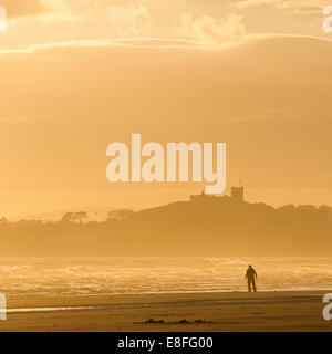 Man alone on beach Stock Photo