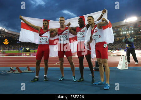 Adam Gemili, Harry Aikines-Aryeetey, Richard Kilty and Danny Talbot (all ENG) pose with the flag. England take the Silver Medal Stock Photo