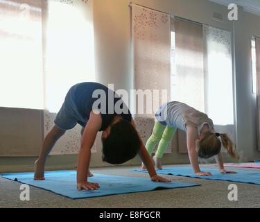 Small Boy On Yoga Mat Home Stock Photo 1703802922