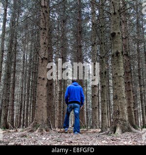 Man standing in forest Stock Photo