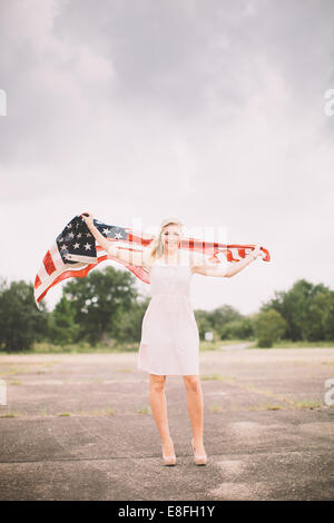Portrait of a woman holding an American flag, Fort Walton Beach, Florida, USA