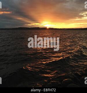 Sunset across lake Stock Photo