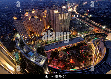 Indonesia, Jakarta Special Capital Region, Daerah Khusus Ibukota Jakarta, Letjen S Parman, Night cityscape seen from Alaina Tower (Central Park)