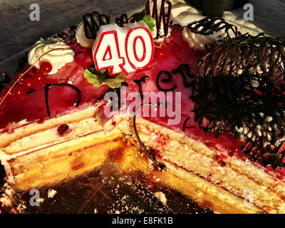 40th birthday cake with slice missing Stock Photo