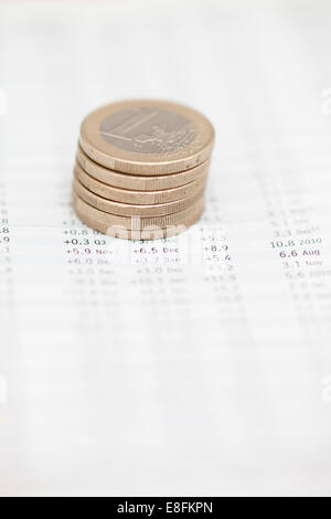 Stack Of Euro Coins On Financial Data Stock Photo