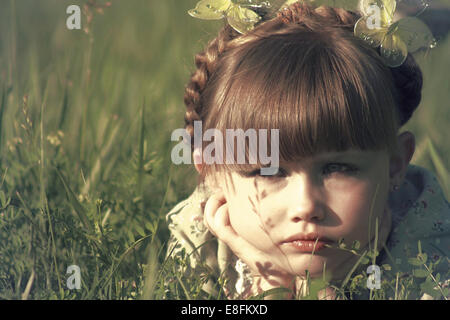 Portrait of a girl lying in a meadow Stock Photo