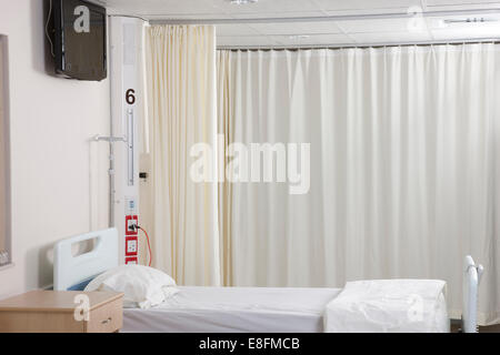 Empty hospital bed on hospital ward Stock Photo