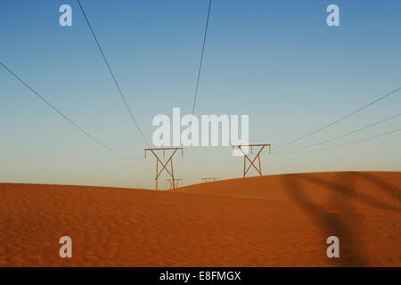 Power lines in desert, Namibia Stock Photo