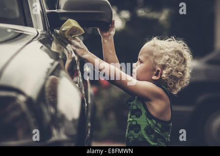 Boy washing car Stock Photo