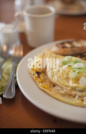 Close-up of cheese and onion omelette breakfast with toast Stock Photo