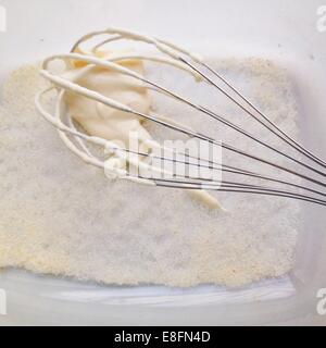 Whisk mixing cream and sugar Stock Photo