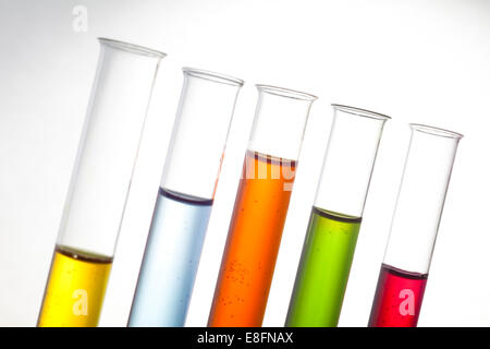 Row of test tubes with multi coloured liquid Stock Photo