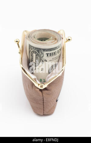 Roll of US dollar bills in a purse Stock Photo