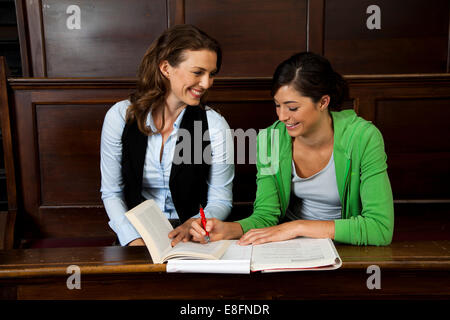 Mature student studying with her teacher Stock Photo