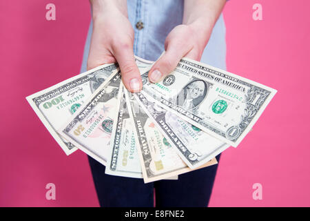 Woman holding banknotes Stock Photo