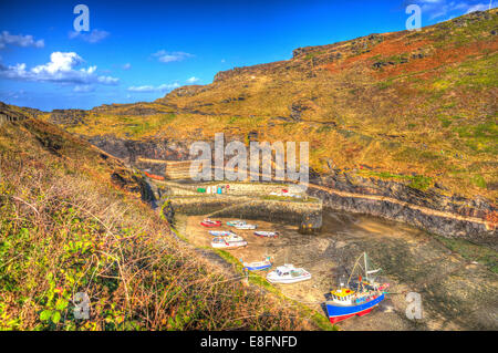 Autumn in Boscastle harbour North Cornwall between England UK like painting on a beautiful sunny blue sky day in HDR Stock Photo