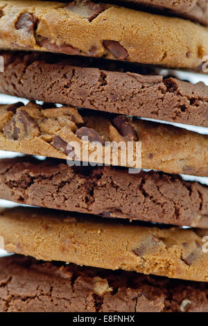 Full frame close-up of a stack of chocolate chip cookies on a table Stock Photo
