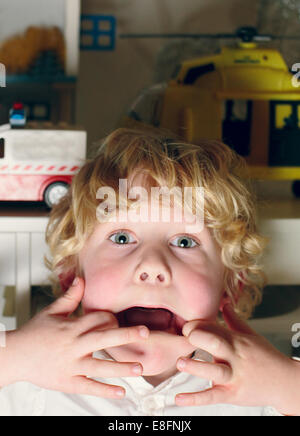 Netherlands, Portrait of boy making funny faces Stock Photo
