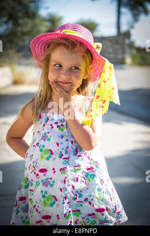 Front view of girl wearing summer hat