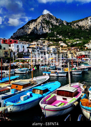 Italy, Capri, colorful boats in harbor