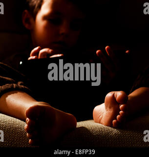 Portrait of boy (2-3) using digital tablet Stock Photo