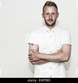 Portrait of man with his arms crossed Stock Photo