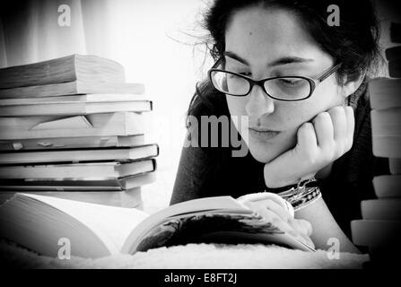 Close-up of young woman reading a book Stock Photo