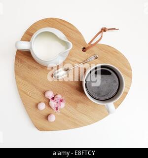 Heart shaped chopping board with coffee and truffles Stock Photo