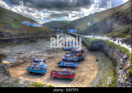 Boats in Boscastle harbour North Cornwall England UK like painting on a beautiful sunny blue sky day in HDR Stock Photo