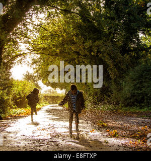 Boys splashing in water Stock Photo