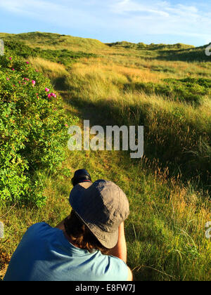 Man taking a photo, Fanoe, Jutland, Denmark Stock Photo