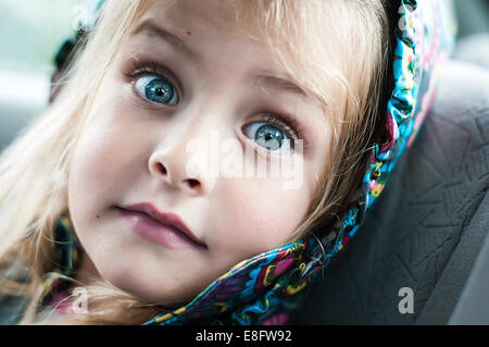 Portrait of little girl with surprised expression on her face Stock Photo