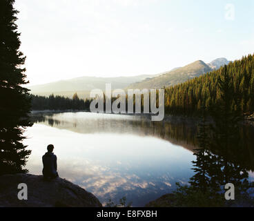 USA, Colorado, Larimer County, Rocky Mountain National Park, Silhouette man looking at sunrise Stock Photo