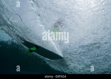 Surfer seen from underwater Stock Photo