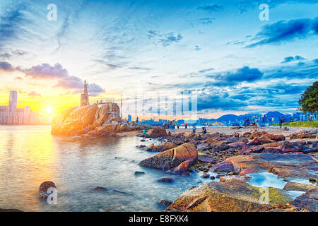 Hong Kong Sunset, Yau Tong Lei Yue Mun water bay and lighthouse Stock Photo