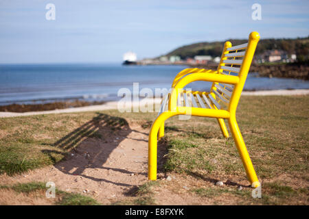 Yellow bench Brodick Isle of Arran, Scotland Stock Photo