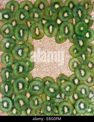 Close-up of sliced kiwi fruit arranged in an oblong pattern Stock Photo