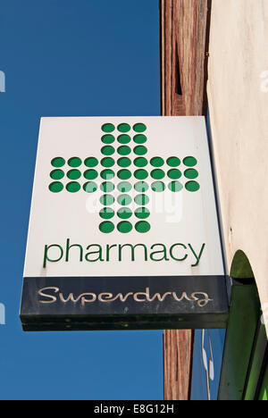 hanging sign for a pharmacy at a branch of superdrug, east sheen, london, england Stock Photo