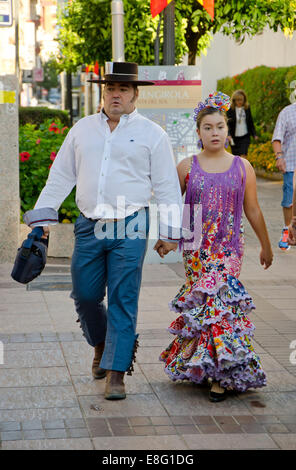 Father an daughter in traditional dress during annual local festival, fair, festivities of Fuengirola, Andalusia, Spain Stock Photo