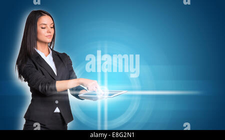 Beautiful businesswomen in suit using digital tablet Stock Photo