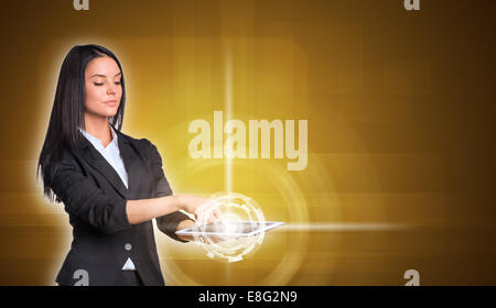 Beautiful businesswomen in suit using digital tablet Stock Photo